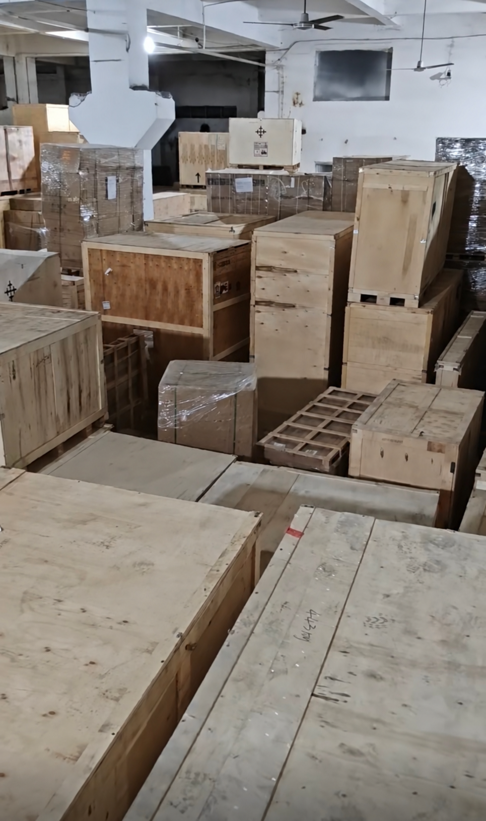 Consolidation warehouse holding furniture cartons and crated items before loading
